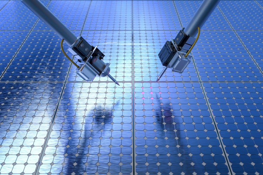 MIT研究チームが開発した自律ロボットシステムが新しい半導体素材の光電導特性を高精度で測定している様子。
