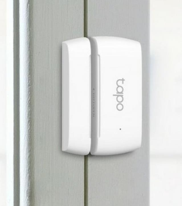 Photo of a 'Door Open Detection Device' sending instant notifications to a mobile app