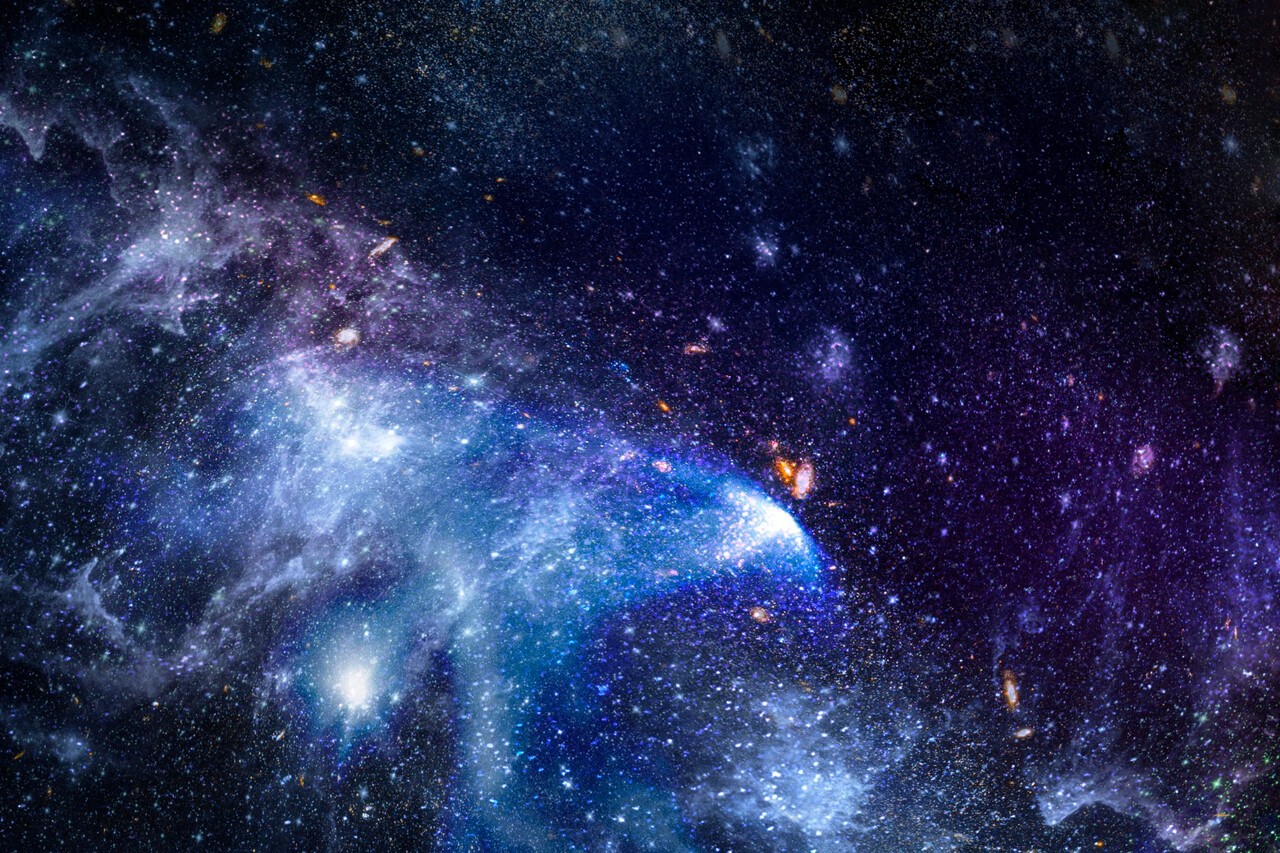 初期宇宙で形成され始めた銀河を描いた画像。今回の研究では、宇宙誕生から約10億年後の時点で、重元素が際立って少ない銀河17個が密集する領域が確認された。（写真：ソリューションニュース・マグニフィック、転載・データベースへの収録を禁ず）